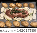 Preparing roast pork with rosemary 142017580