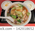 Chinese-style soup set meal with green vegetables and pork in a thick sauce. 142018652