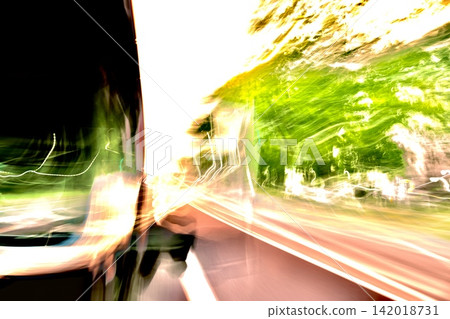 Abstract speed background featuring a bus moving with light and green street trees. Abstract speed background featuring a bus moving with light and green street trees. 142018731