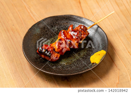 Grilled pork stomach skewers with a delightful chewy texture. Grilled pork stomach skewers with a delightful chewy texture. 142018942