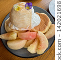 Soufflé pancakes with peaches and whipped cream 142021698