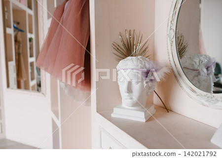 Decorative Plaster Bust with Floral Headband in Boutique Interior Decorative Plaster Bust with Floral Headband in Boutique Interior 142021792