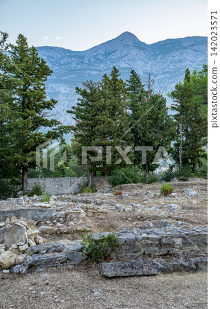 Ancient Ruins Set Against Majestic Mountain Range Ancient Ruins Set Against Majestic Mountain Range 142023571