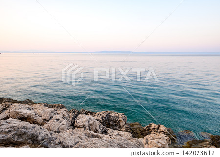 A serene coastal scene from a rocky vantage point A serene coastal scene from a rocky vantage point 142023612