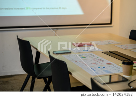 Graphs and business tools placed on the conference room table Graphs and business tools placed on the conference room table 142024192