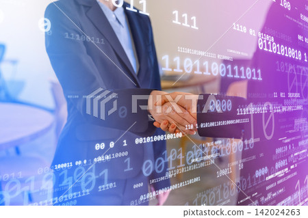Business people in suits shaking hands Business people in suits shaking hands 142024263