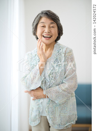 Portrait of an 80-year-old woman Portrait of an 80-year-old woman 142024572
