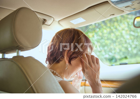 A senior couple going out in their car A senior couple going out in their car 142024766