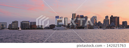 Boston skyline illuminated at dusk with Atlantic Ocean on the foreground, USA Boston skyline illuminated at dusk with Atlantic Ocean on the foreground, USA 142025763