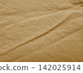 wrinkled tan linen fabric texture background for sustainable web design branding and organic advertising layouts 142025914
