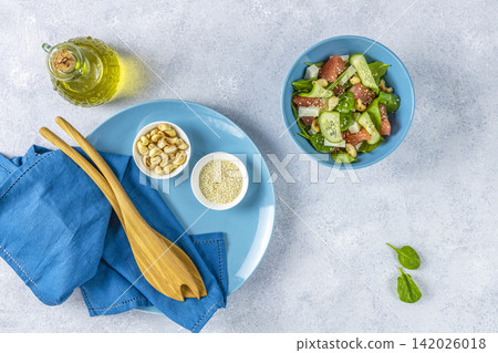 Vegan plate with lettuce, feta cheese, grapefruit, sesame and nuts Vegan plate with lettuce, feta cheese, grapefruit, sesame and nuts 142026018