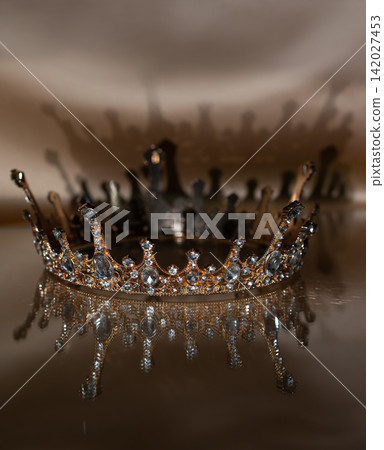 Luxury Golden Crown with Crystal Details and Reflection on Brown Background. Royal Elegance. 142027453