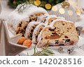Sliced Christmas Stollen with Almonds and Ornaments 142028516