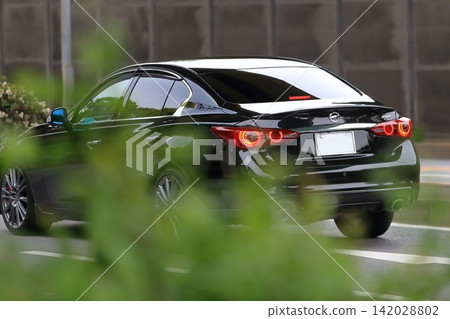 Image of a black luxury sports sedan Image of a black luxury sports sedan 142028802