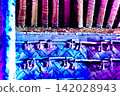The woven wooden walls and rope decorations of the ancient dwelling shimmer with a blue-purple glow. 142028943