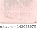 Minimalist background material featuring a pale pink concrete wall and separator holes. 142028975