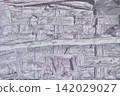 A gray wooden wall texture background made from a combination of decaying old wood. 142029027