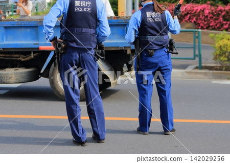 Image of a police officer directing traffic. Image of a police officer directing traffic. 142029256
