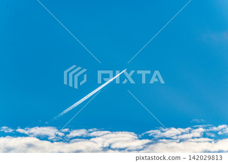 Blue sky, white clouds, and an airplane ① Blue sky, white clouds, and an airplane ① 142029813