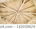 A radiating wooden frame ceiling and a white wood attic structure. 142030629