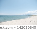 A summer coastal scene with white sandy beaches and a blue sea. 142030645