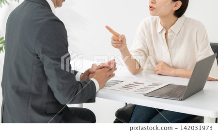 A businessman and a woman apologizing A businessman and a woman apologizing 142031973