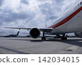 Close-up of the engine and wing of the government aircraft waiting on the tarmac. 142034015