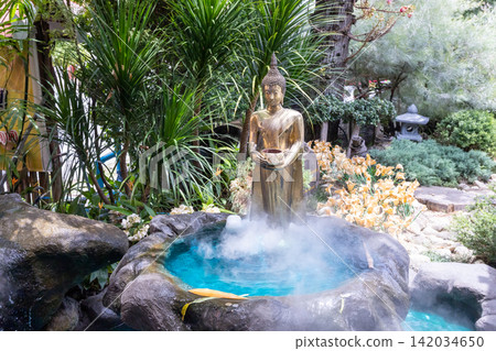 Serene Buddha statue amidst mystical mist Serene Buddha statue amidst mystical mist 142034650