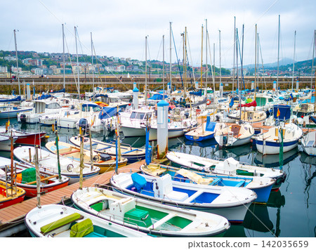 A marina in San Sebastian, Spain, where yachts and boats are moored. A marina in San Sebastian, Spain, where yachts and boats are moored. 142035659