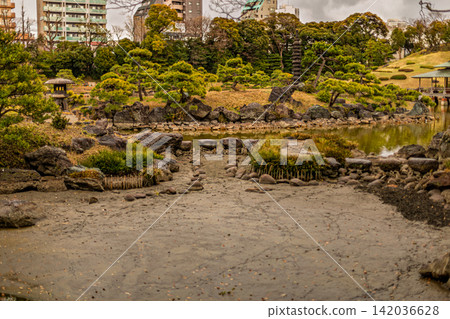 A nostalgic landscape of a pond and multi-story pagoda in warm tones. Kiyosumi Garden, March 2024. A nostalgic landscape of a pond and multi-story pagoda in warm tones. Kiyosumi Garden, March 2024. 142036628