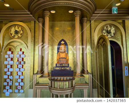 The statue of Billiken, the god of good fortune, and the gold leaf decorations enshrined in Tsutenkaku Tower in Osaka. The statue of Billiken, the god of good fortune, and the gold leaf decorations enshrined in Tsutenkaku Tower in Osaka. 142037365