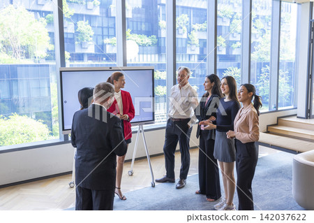 Diverse businesspeople gather in board room take part in meeting. successful negotiations concept. Diverse businesspeople gather in board room take part in meeting. successful negotiations concept. 142037622