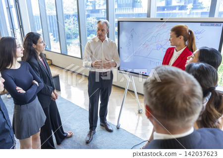 Diverse businesspeople gather in board room take part in meeting. successful negotiations concept. Diverse businesspeople gather in board room take part in meeting. successful negotiations concept. 142037623