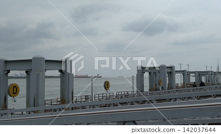 Taiwan New Taipei-10.10.2022: Taiwan Historical Scenic View: Tamsui Ferry Wharf View of Tamsui River Port in front of Jian Tamjiang Bridge Taiwan New Taipei-10.10.2022: Taiwan Historical Scenic View: Tamsui Ferry Wharf View of Tamsui River Port in front of Jian Tamjiang Bridge 142037644