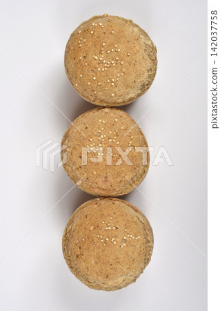 Three Freshly Baked Quinoa Bread Rolls Top View Three Freshly Baked Quinoa Bread Rolls Top View 142037758