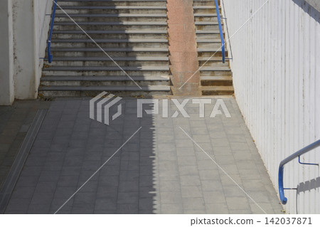 Concrete pedestrian underpass with stairs and a bicycle ramp Concrete pedestrian underpass with stairs and a bicycle ramp 142037871