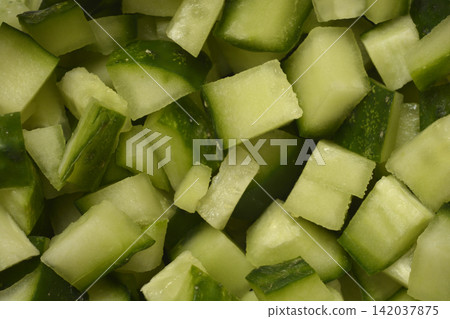 Chopped fresh green cucumber cubes close up Chopped fresh green cucumber cubes close up 142037875