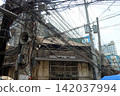 Tangled power lines in a residential area 142037994