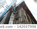 Traditional houses and utility poles 142037998