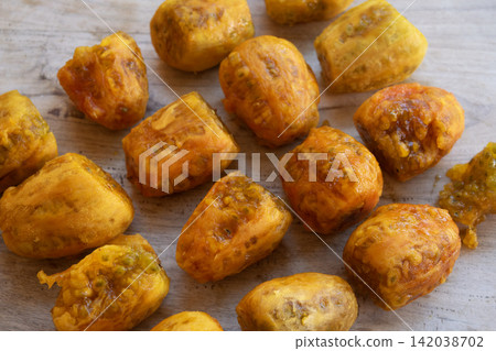peeled prickly pear fruits on wooden background peeled prickly pear fruits on wooden background 142038702