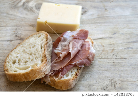 prosciutto bread cheese wooden board prosciutto bread cheese wooden board 142038703