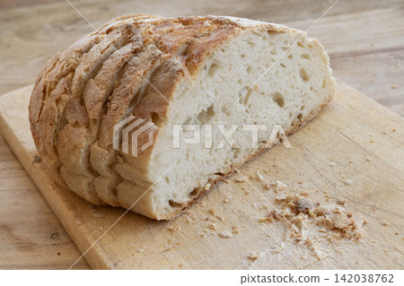 Fresh sourdough bread on wooden board Fresh sourdough bread on wooden board 142038762