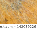 Orange wood grain texture with natural gray streak and weathered surface detail for rustic background 142039226