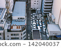 High angle view of crowded outdoor car parking lot between buildings in Tohima, Ikebukuro, Tokyo, Japan 142040037