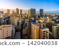 Modern city skyline and skyscrapers at sunrise in Toshima, Ikebukuro, Tokyo, Japan 142040038