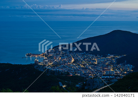 Budva city lights at night from high viewpoint in Montenegro Budva city lights at night from high viewpoint in Montenegro 142040171