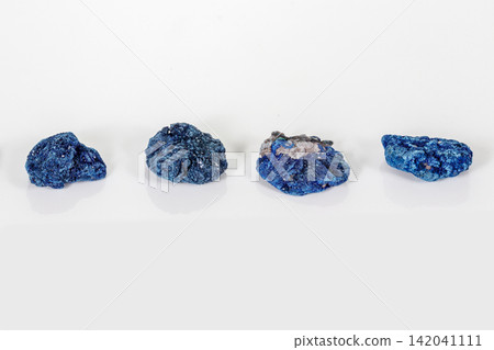 Macro mineral stone Malachite and Azurite against white background Macro mineral stone Malachite and Azurite against white background 142041111