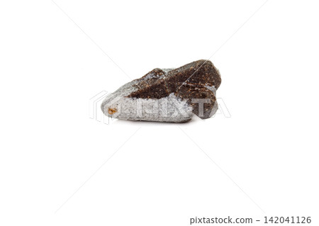 macro mineral stone Staurolite on a white background macro mineral stone Staurolite on a white background 142041126