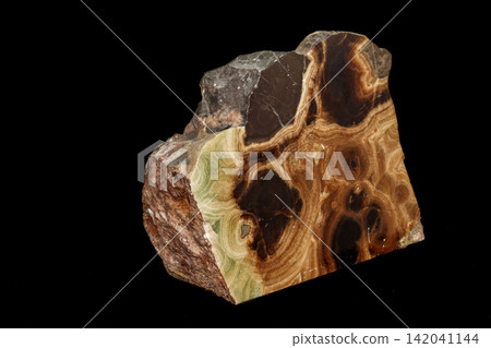 Macro stone mineral onyx marble on a black background Macro stone mineral onyx marble on a black background 142041144