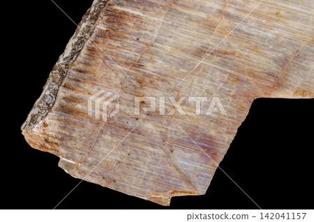 Macro of a stone mineral Moonstone on a black background Macro of a stone mineral Moonstone on a black background 142041157